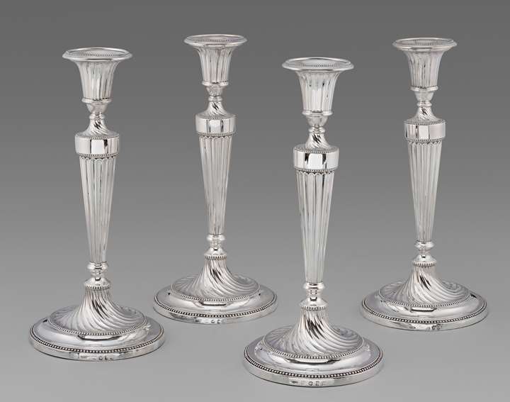 Four Elegant Georgian Neo-Classical Candlesticks